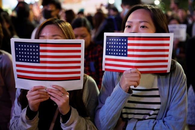 China furious, Hong Kong celebrates after US move on bills